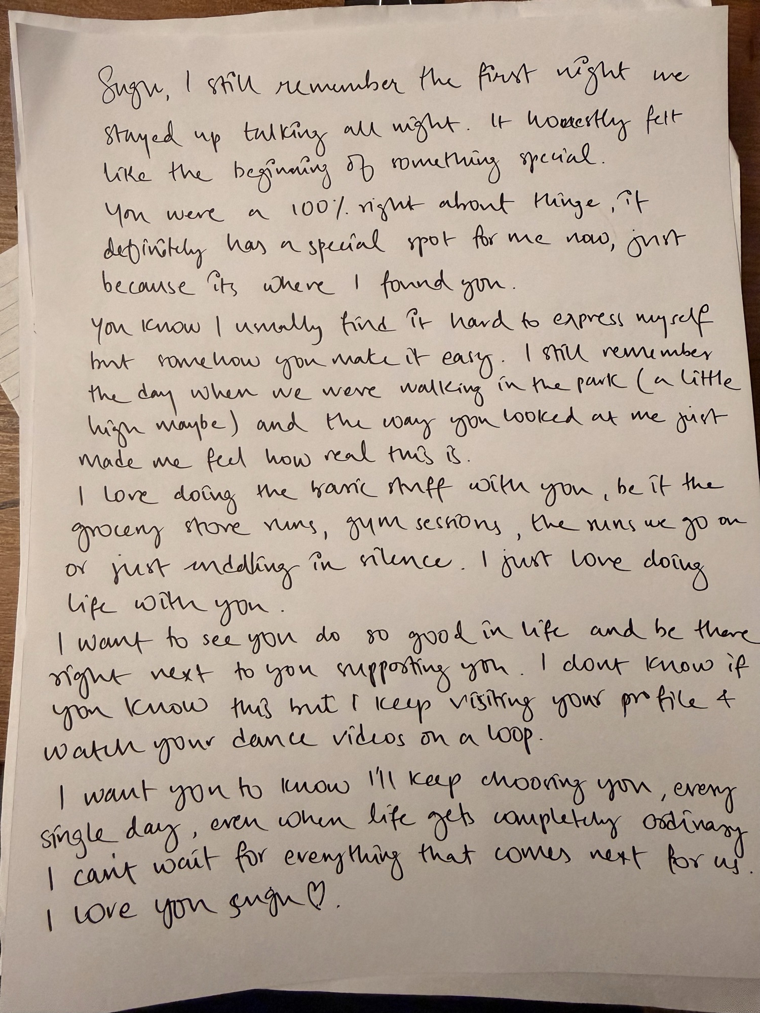 A handwritten love note on paper